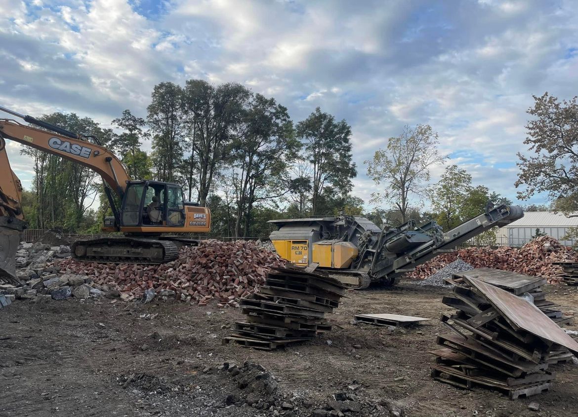 Case Excavator Working On A Pile Of Bricks — Chambersburg, PA — Dave’s Truck Repair Inc. 