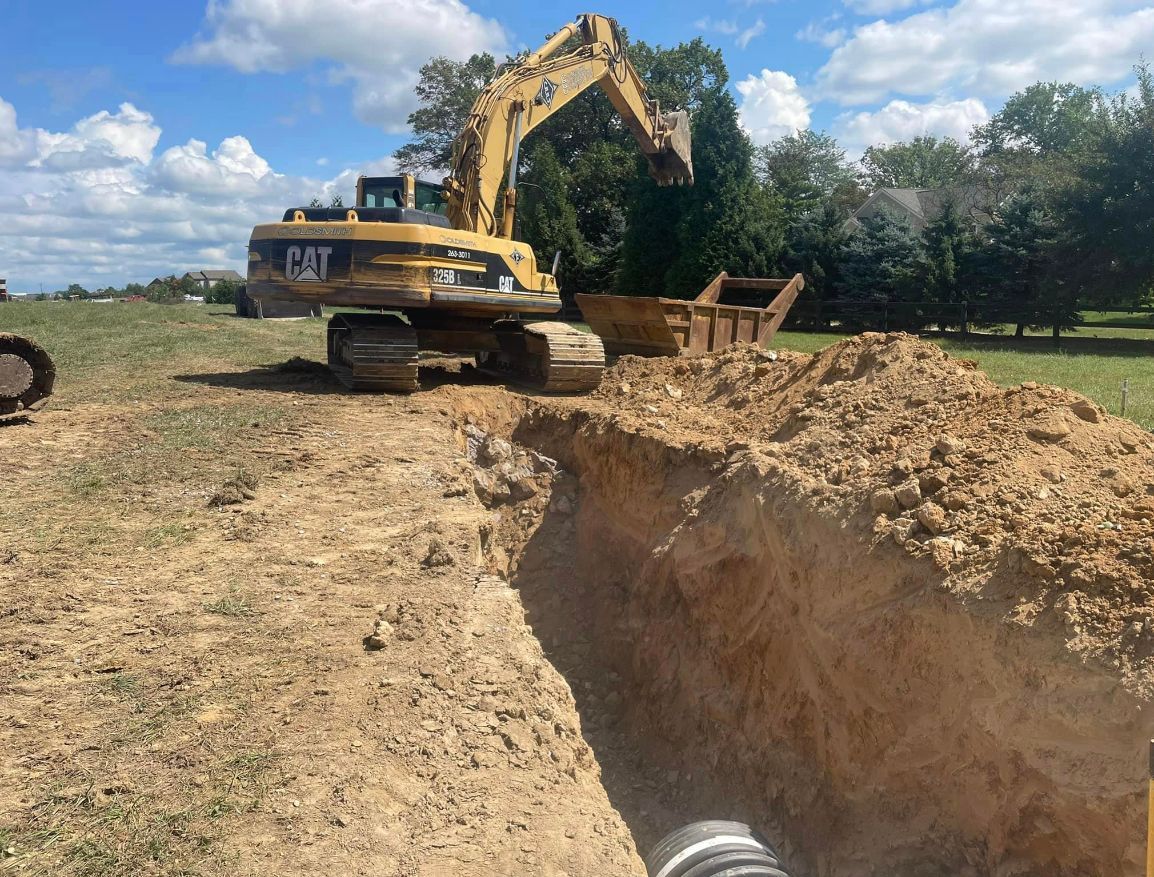 Yellow Excavator Digging A Hole — Chambersburg, PA — Dave’s Truck Repair Inc. 