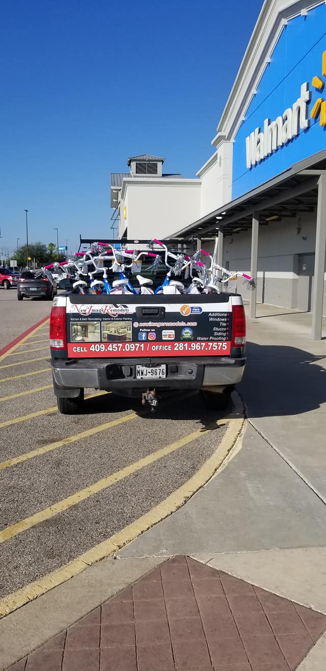 A truck is parked in front of a walmart store.