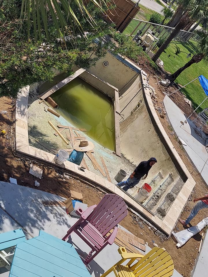 An aerial view of a swimming pool under construction.