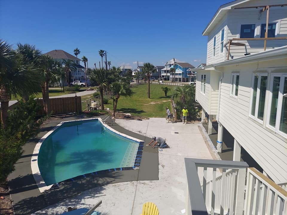 A large white house with a swimming pool in the backyard