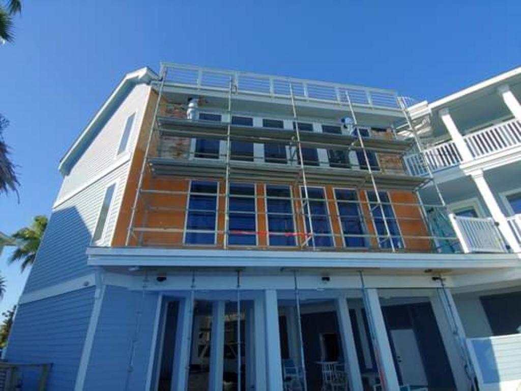 A large building under construction with scaffolding around it.