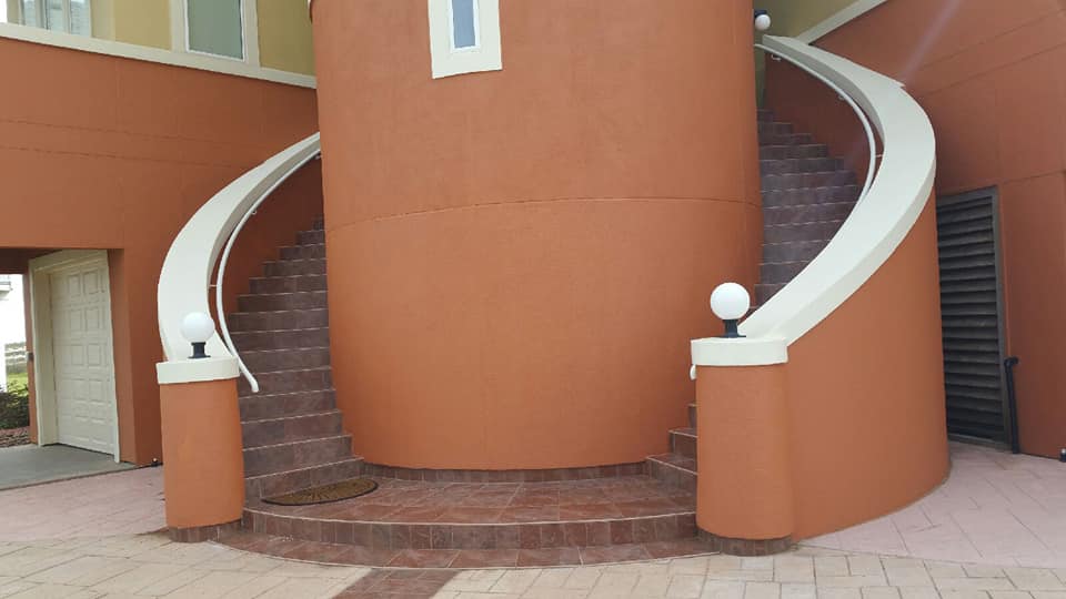 A curved staircase leading up to the top of a building