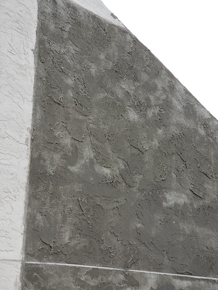 A close up of a concrete wall with a white background