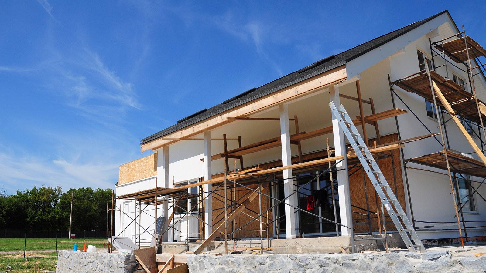 A house is being built with scaffolding around it.