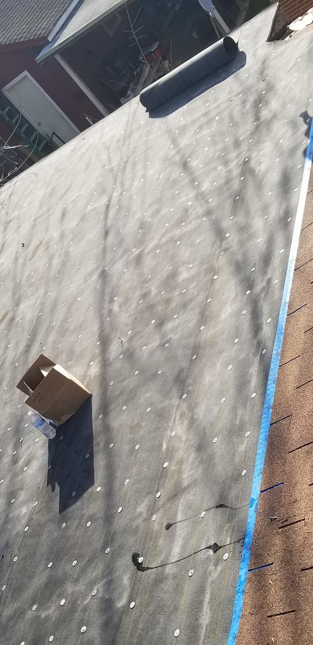 A close up of a roof with a box on it.