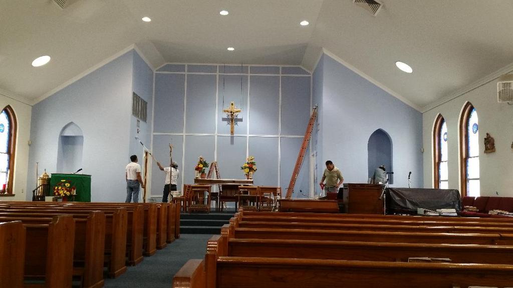 The inside of a church with a cross on the wall