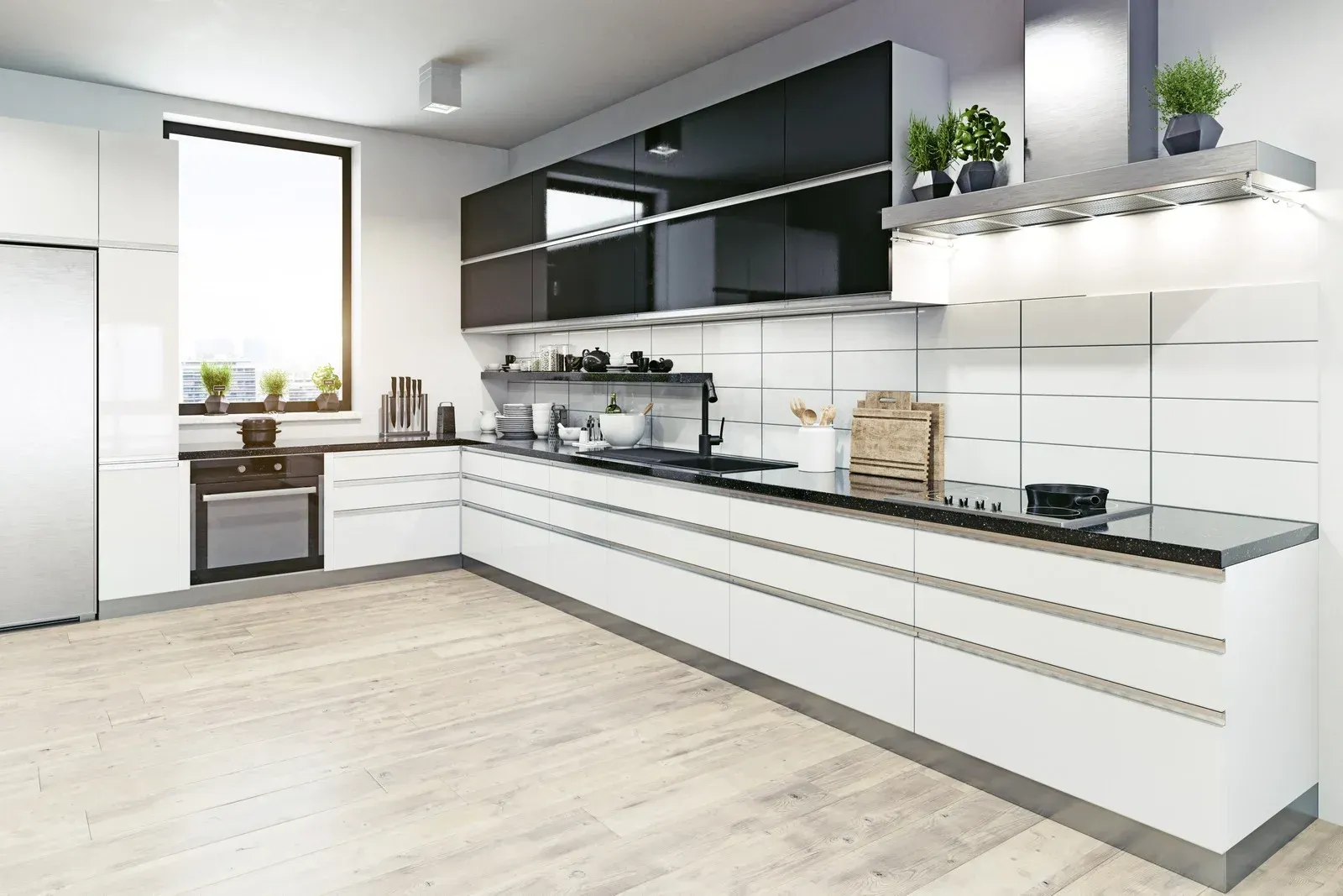 Modern, white kitchen with black upper cabinets, stainless steel accents, and a large window.