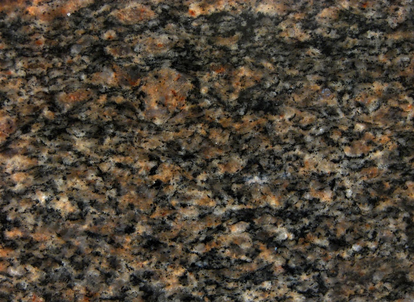 Un primer plano de una encimera de granito marrón