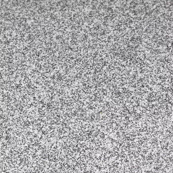 Un primer plano de una textura de alfombra gris y blanca.