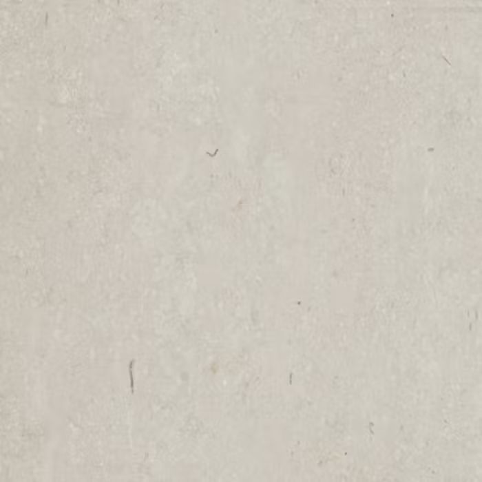 Un primer plano de un trozo de papel blanco con textura granulada.