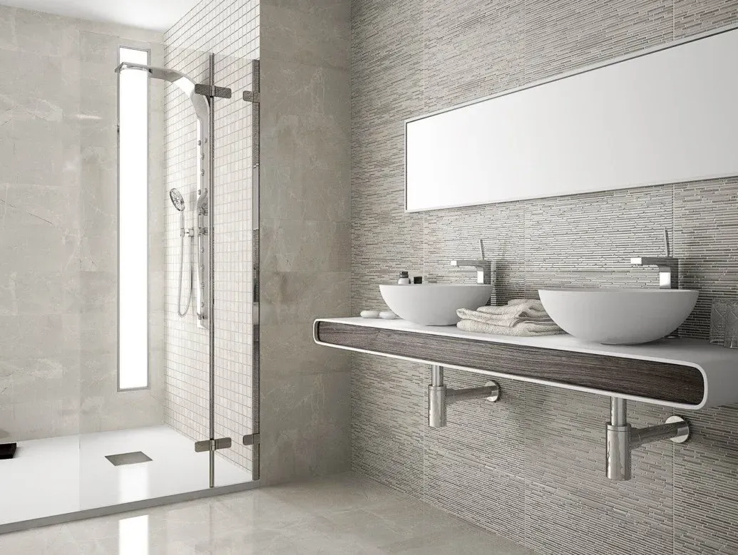 Un baño con dos lavabos, una ducha y un espejo.