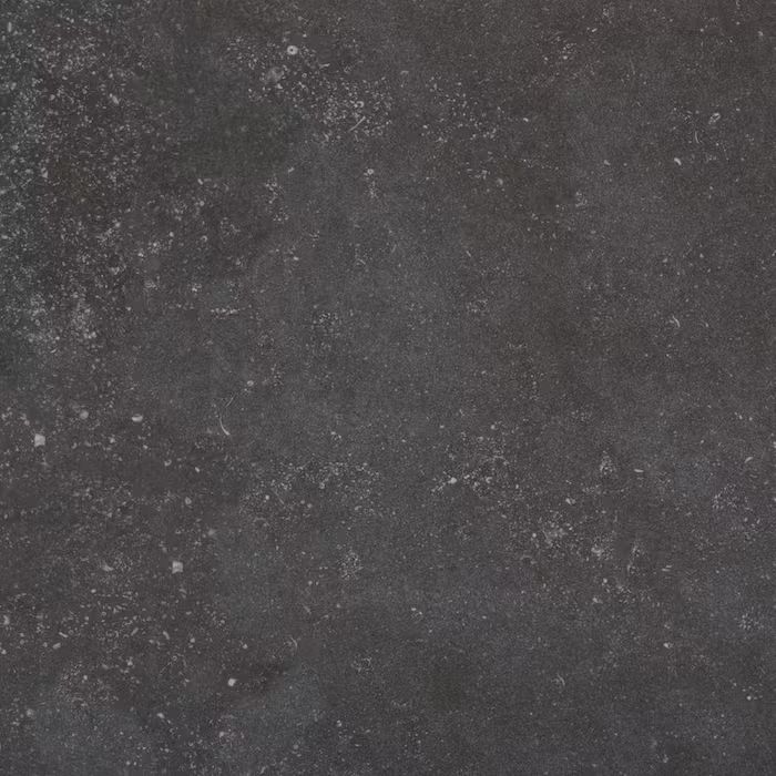 Un primer plano de un azulejo negro con textura granulada.