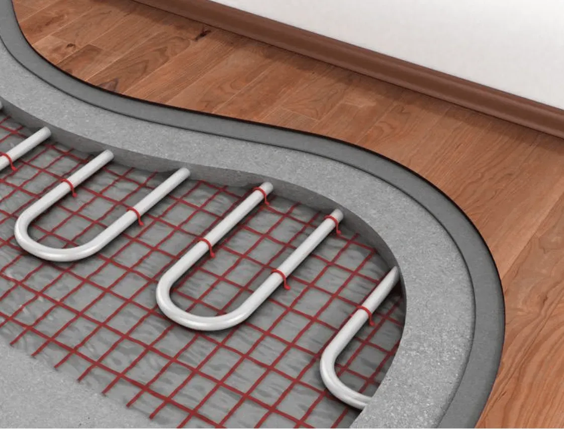 Una imagen de un sistema de calefacción por suelo radiante sobre un suelo de madera.