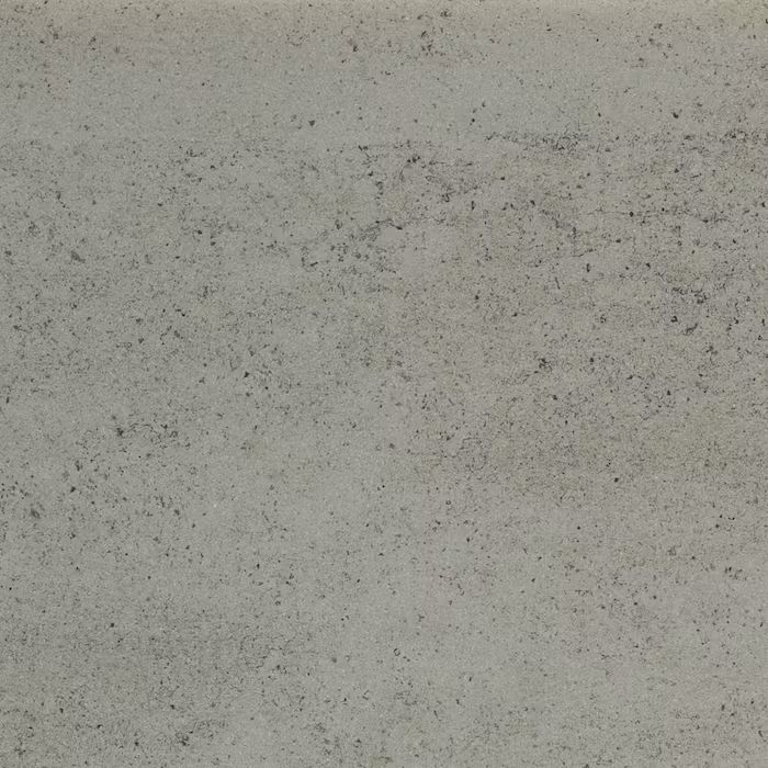 Un primer plano de un azulejo gris con textura granulada.