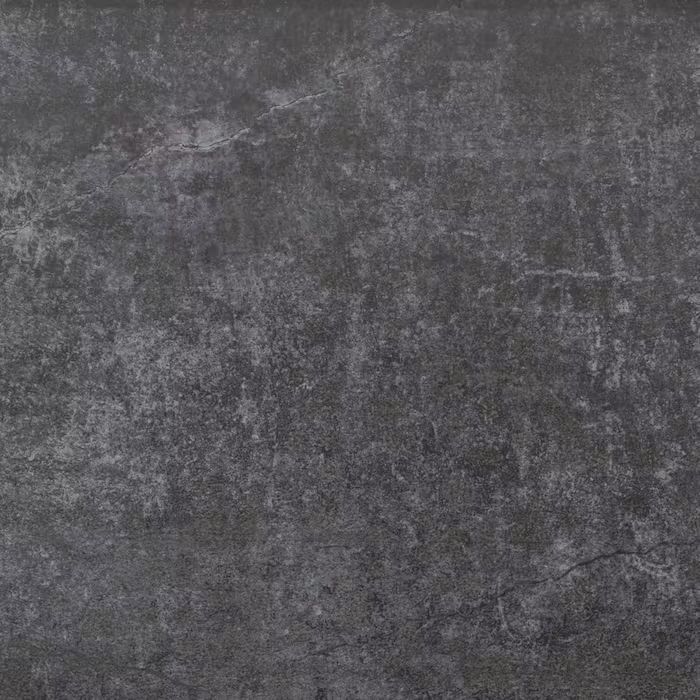 Un primer plano de un azulejo negro con textura gris.