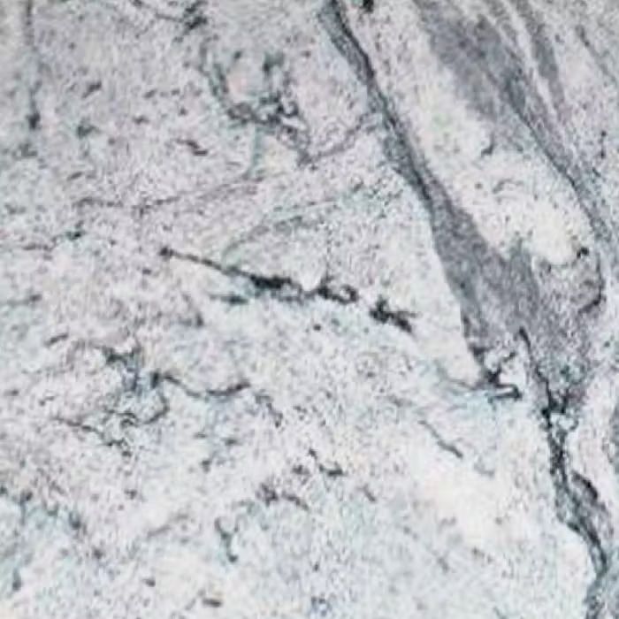 Un primer plano de una encimera de granito blanco con textura de mármol.