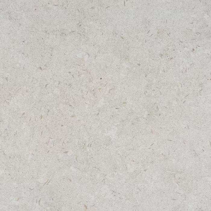 Un primer plano de un azulejo blanco con textura de mármol.