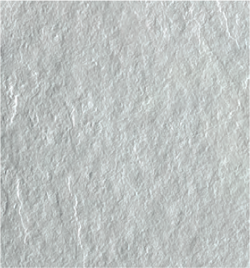 Un primer plano de un azulejo blanco con una textura rugosa.