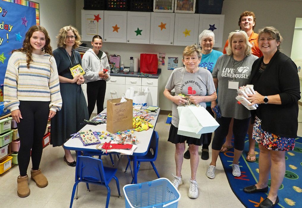 A group of people making blessing bags.