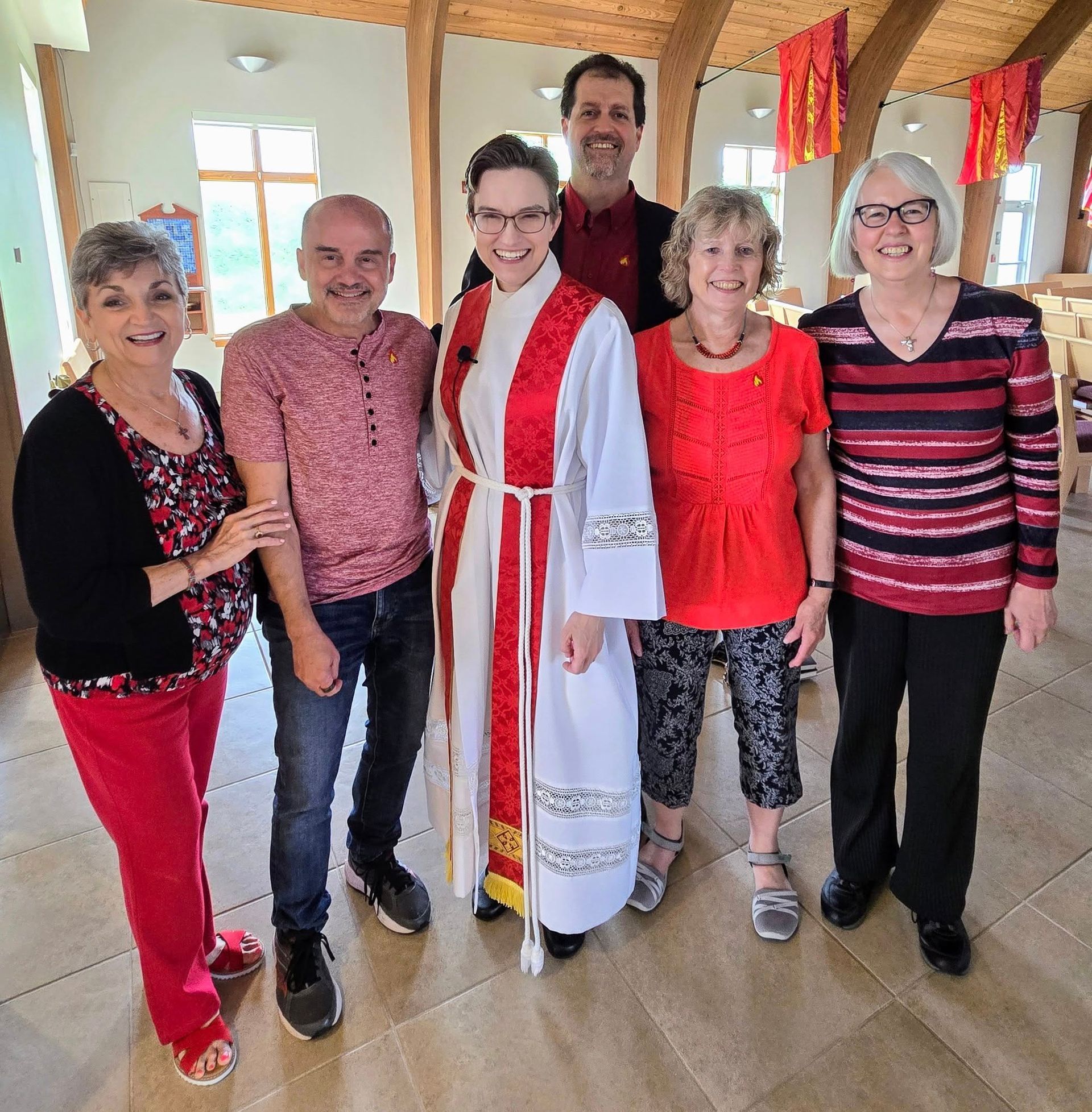 A group of people wearing red for Pentecost.
