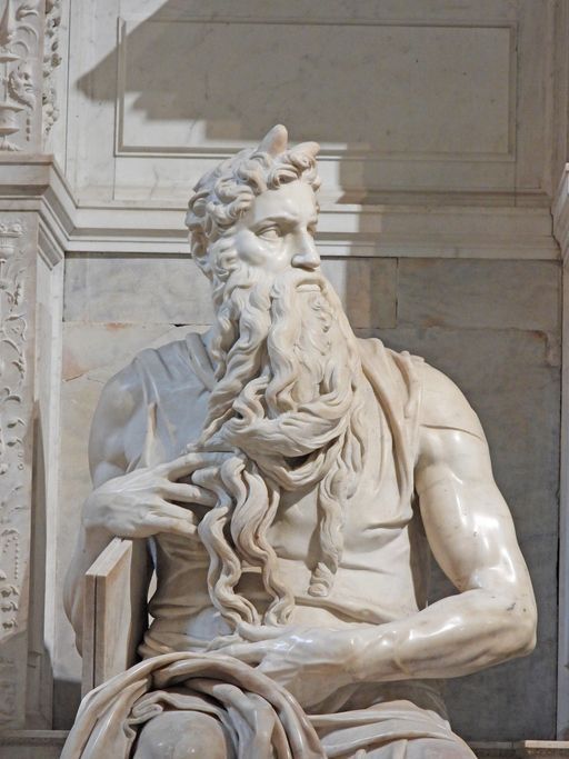 A statue of a man with long hair and a beard