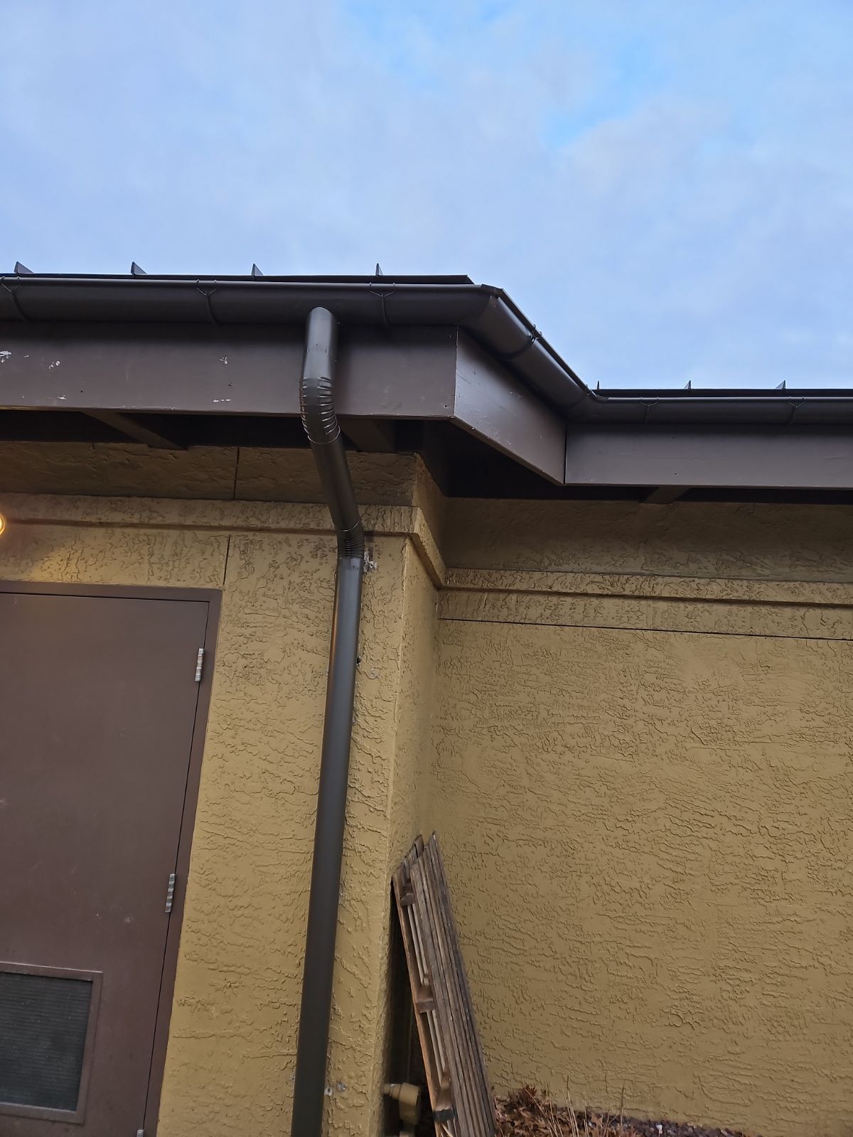 A Yellow Building with a Brown Door and a Brown Gutter – Lititz, PA – Trailside Spouting, LLC