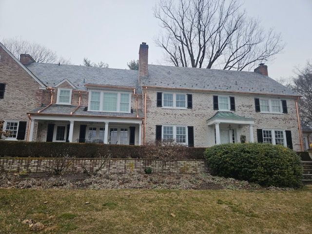 Brick House With A Gray Roof And Black Shutters – Lititz, PA – Trailside Spouting, LLC
