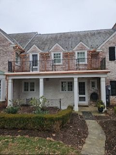 A Large Brick House With A Large Porch And Balcony — Lititz, PA — Trailside Spouting, LLC