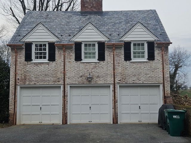 House With Three Garage Doors And A Slate Roof – Lititz, PA – Trailside Spouting, LLC