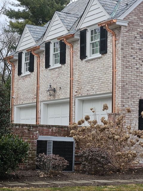A Brick House With Copper Gutters And Black Shutters – Lititz, PA – Trailside Spouting, LLC