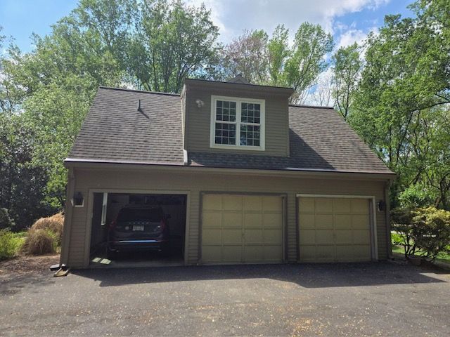 A car is parked in the garage of a house