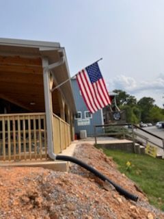 Outside of Warehouse with a flag - Lititz, PA – Trailside Spouting, LLC