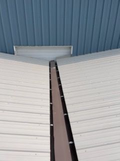 Two images of new roof gutter of warehouse - Lititz, PA – Trailside Spouting, LLC