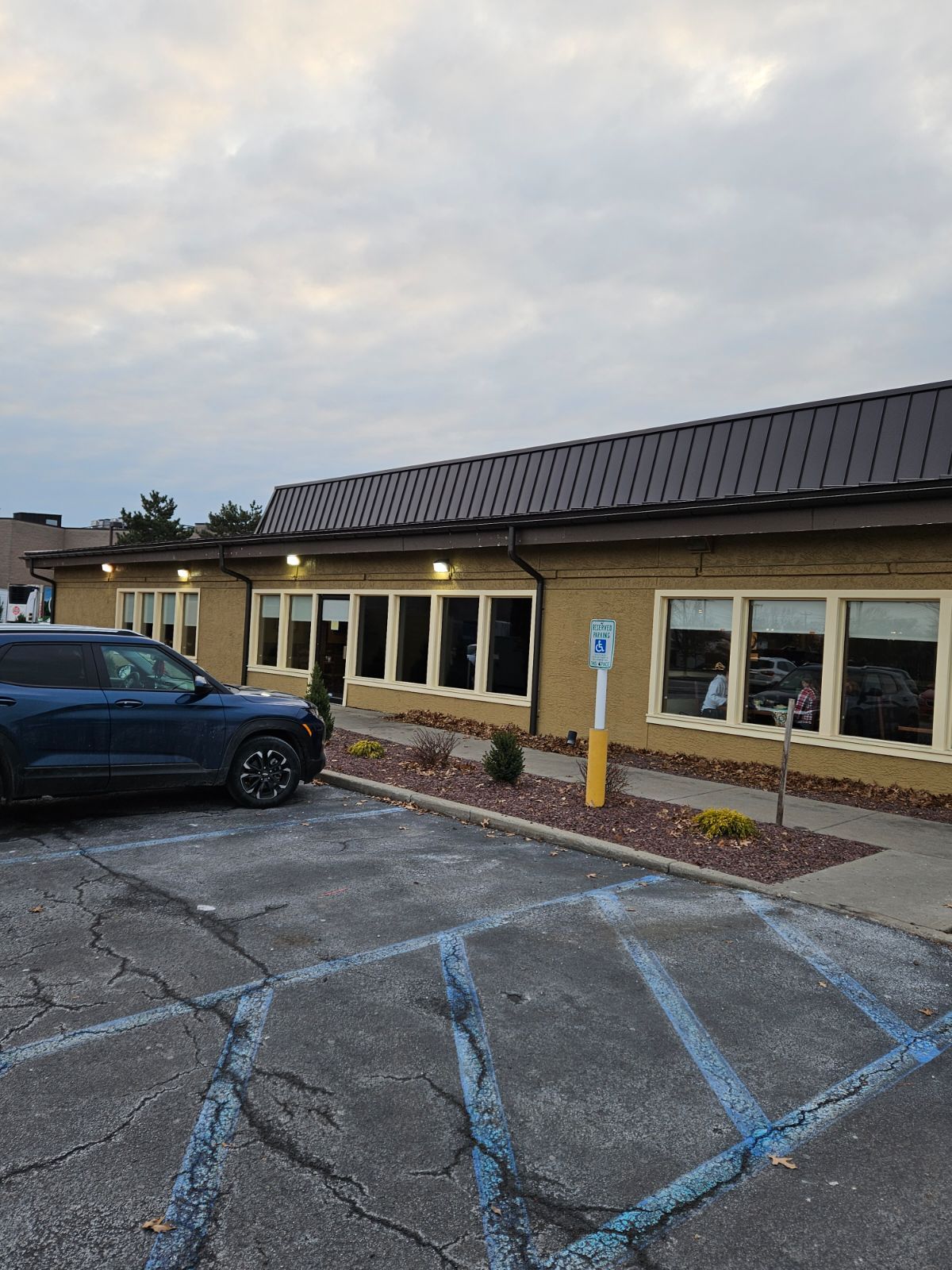 A Blue SUV is Parked in front of a Building – Lititz, PA – Trailside Spouting, LLC