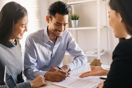 couple signing the document