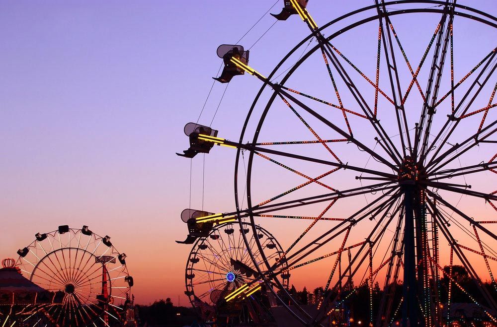 Ferris Wheel with a Sunset Background — AMP Amusements In Bundaberg, QLD