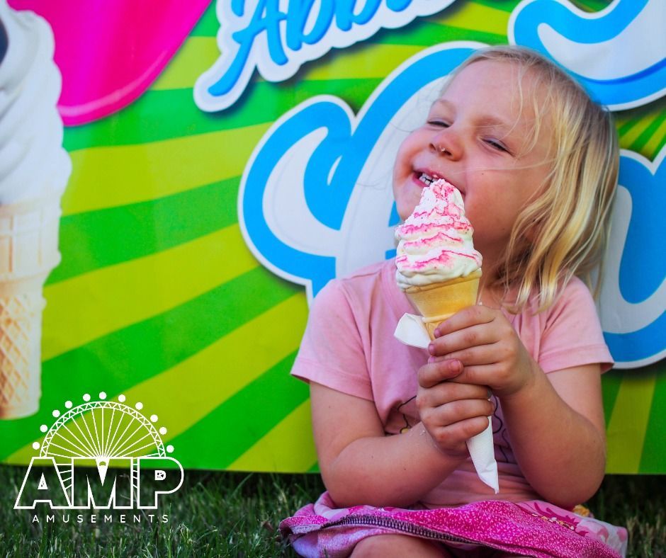 Little Girl Enjoying an Ice Cream — AMP Amusements In Rockhampton, QLD