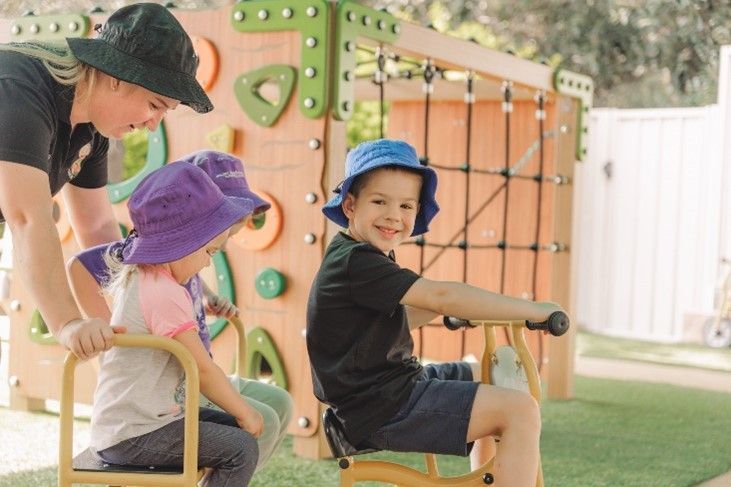 A group of children are playing on a playground.