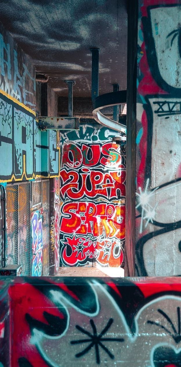 A wall with a lot of graffiti on it