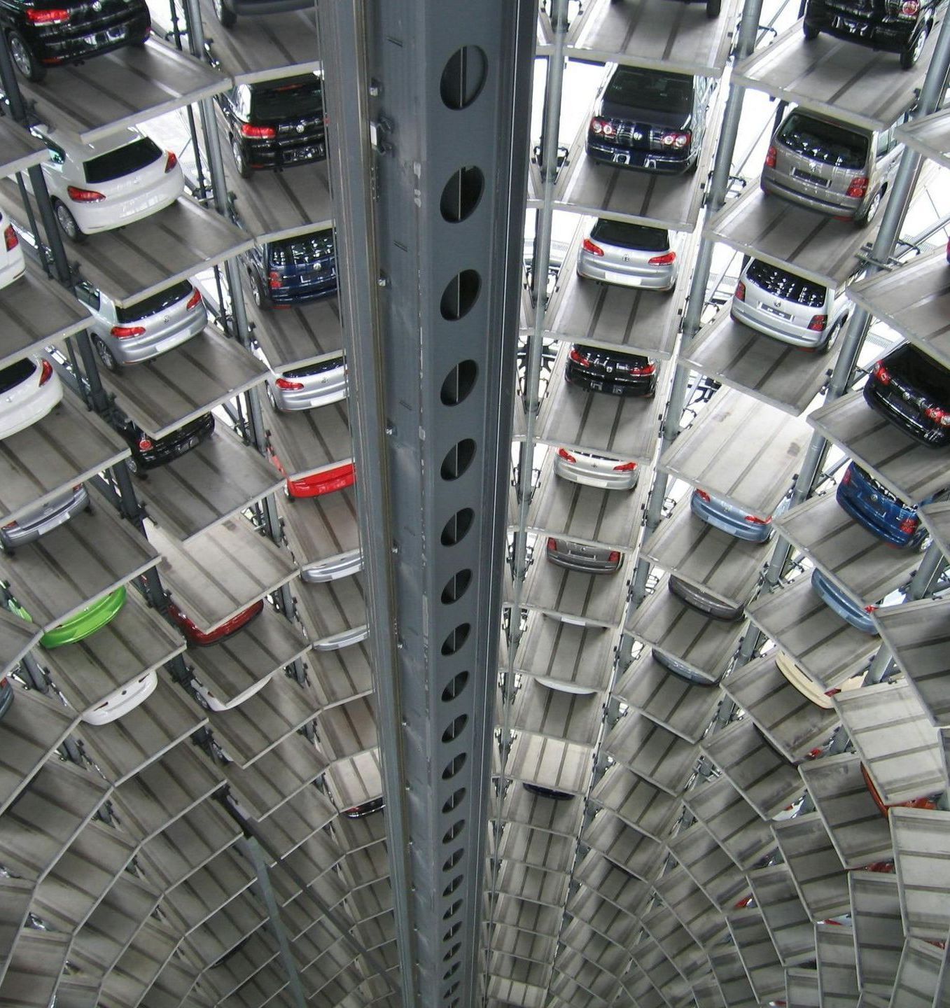 A spiral staircase with lots of cars on it