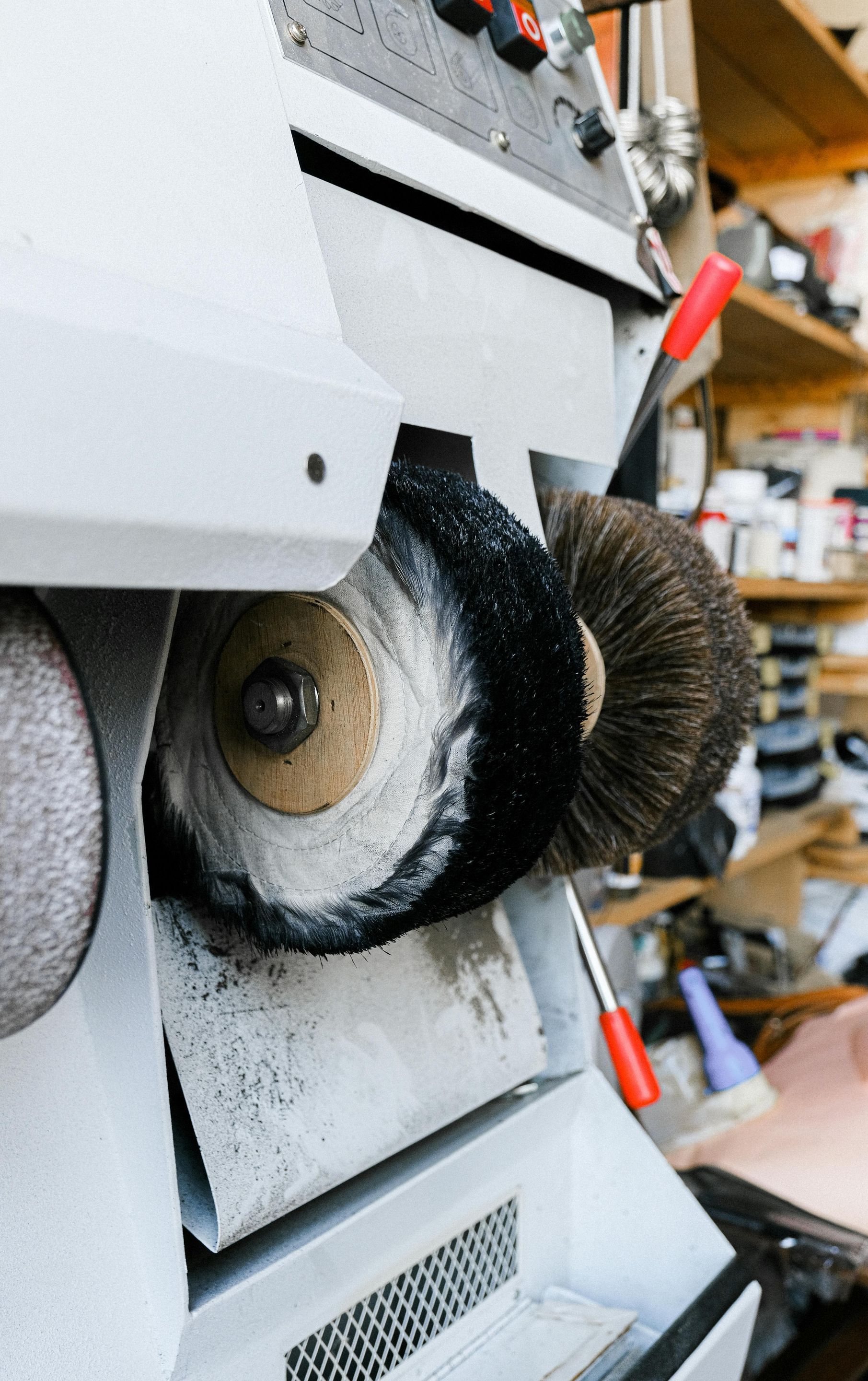A close up of a machine with brushes on it