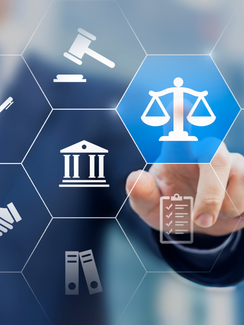Person pointing to a scale of justice icon, surrounded by legal symbols.