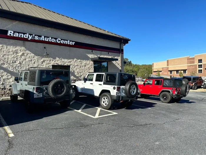 Three Jeeps Parked Outside Auto Shop | Randy's Auto Center