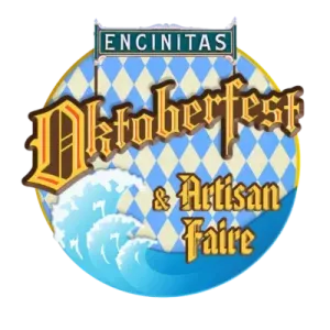 A circular logo for the Encinitas Oktoberfest & Artisan Faire, featuring blue and white diamond patterns and ocean waves.