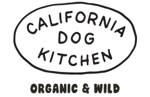 A logo with the text "CALIFORNIA DOG KITCHEN" inside an oval, with "ORGANIC & WILD" written below in a rounded font.