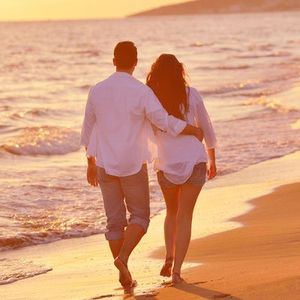 Couple walking on beach