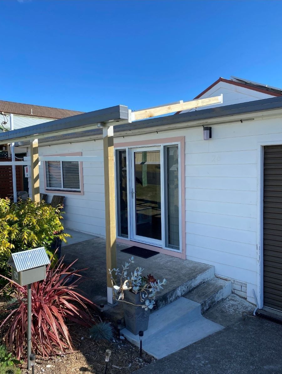 A Small White House With a Mailbox in Front of It — Superior Windows & Doors Taree, NSW