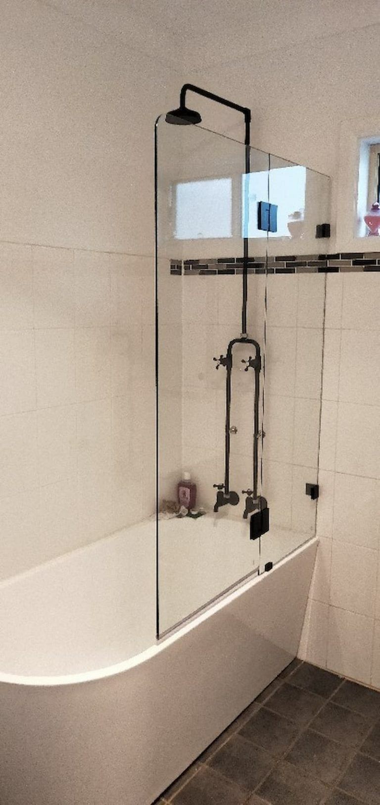 A Bathroom With a Bathtub and a Shower With a Glass Door — Superior Windows & Doors Taree, NSW