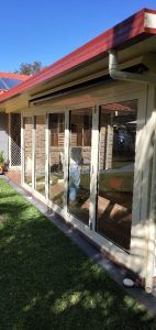 A House With a Lot of Windows and a Red Roof — Superior Windows & Doors Taree, NSW
